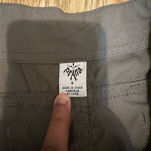 Dark green cargo pants w/ zippers for convertible pants